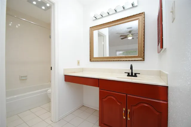 a bathroom with a sink a vanity and a mirror