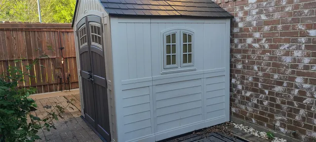 a view of a door and wooden house