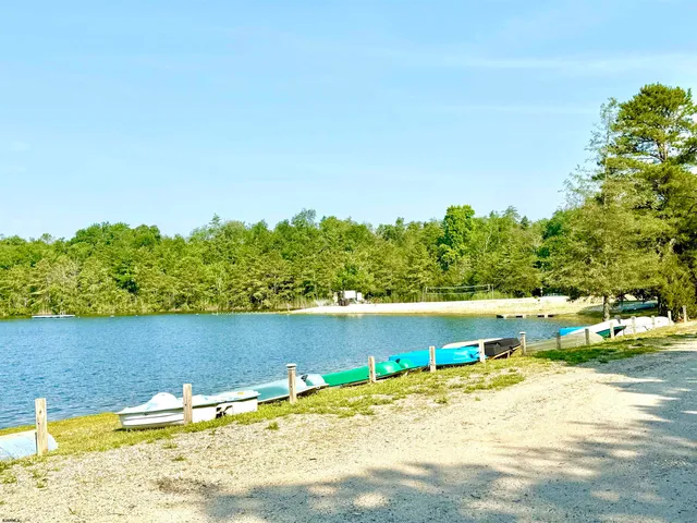 a view of swimming pool with a yard