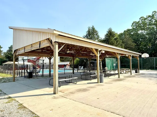a view of a patio with a table and chairs