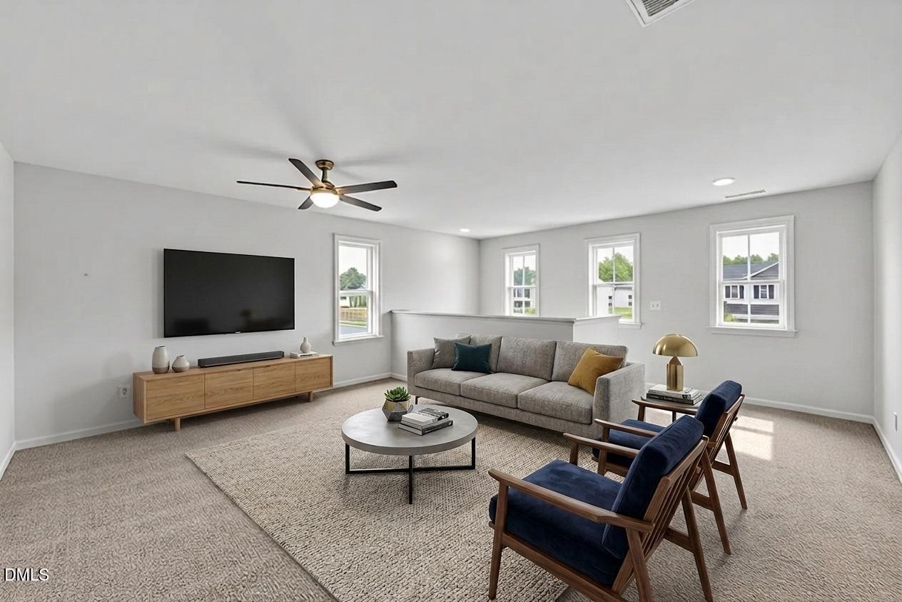 177 Yellowwood Avenue Spring Hope, NC 27882 - Photo 5 of 31 a living room with furniture and a flat screen tv