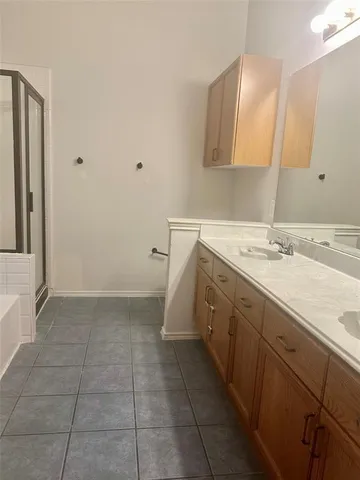a bathroom with a sink a vanity and a mirror