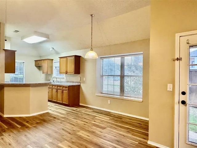 a view of a kitchen with a sink