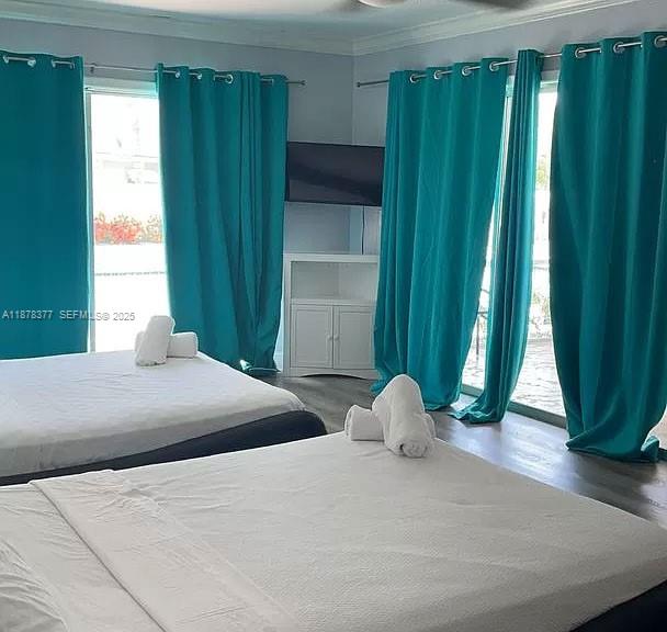 1319 Fillmore Street Hollywood, FL 33019 - Photo 11 of 15 a bedroom with a bed and a window