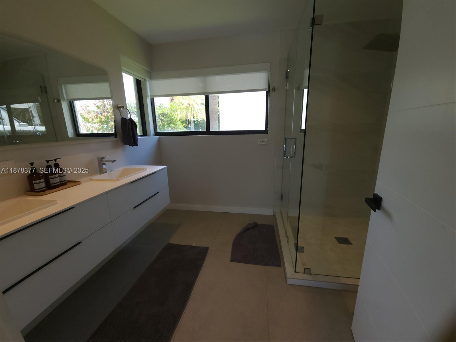 1319 Fillmore Street Hollywood, FL 33019 - Photo 12 of 15 a bathroom with a sink and a mirror