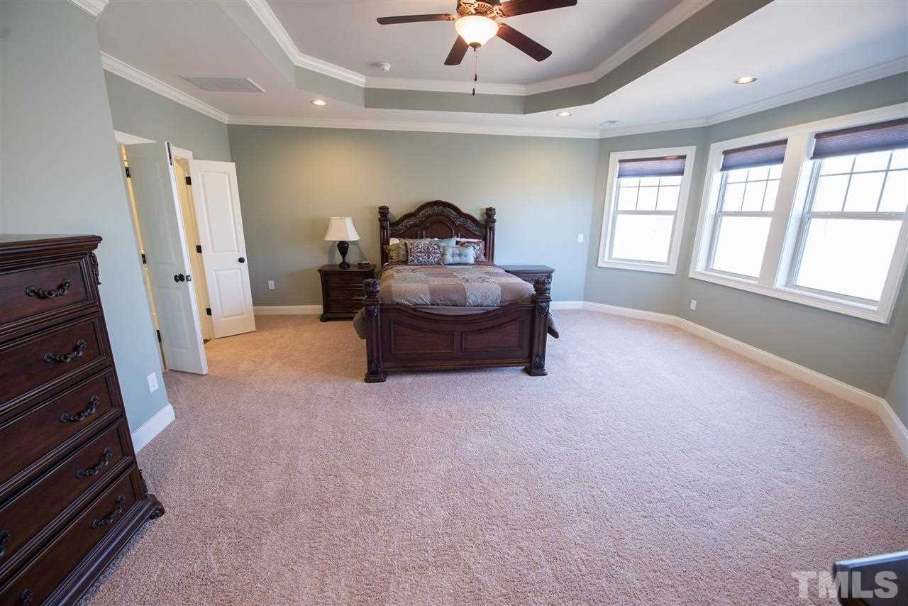 2830 Winter Song Road Raleigh, NC 27614 - Photo 14 of 25 Trey-ceiling, beautiful wall of windows, and SO much space!