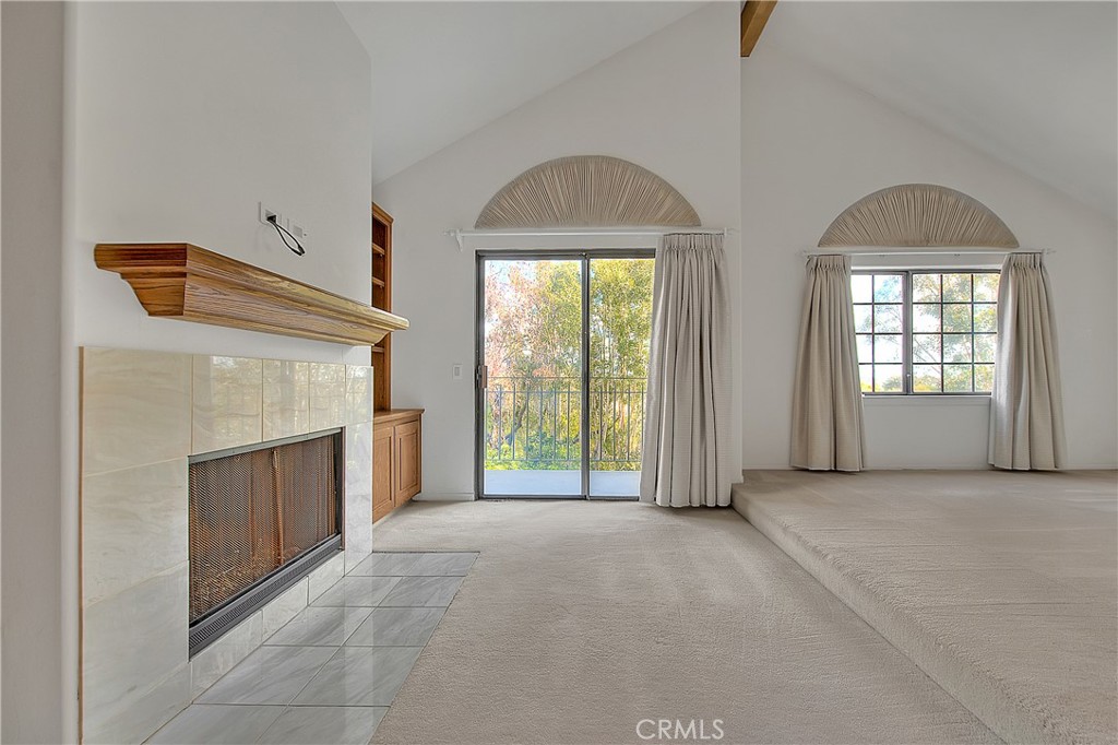 2 Cambridge Manhattan Beach, CA 90266 - Photo 13 of 18 an empty room with windows and fireplace