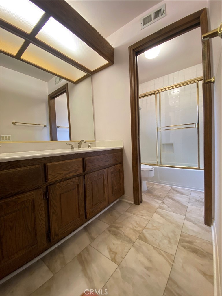 2 Cambridge Manhattan Beach, CA 90266 - Photo 14 of 18 a bathroom with a sink and mirror