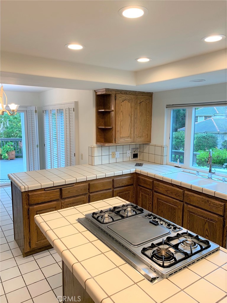 2 Cambridge Manhattan Beach, CA 90266 - Photo 16 of 18 a kitchen with a stove a sink and a counter top space