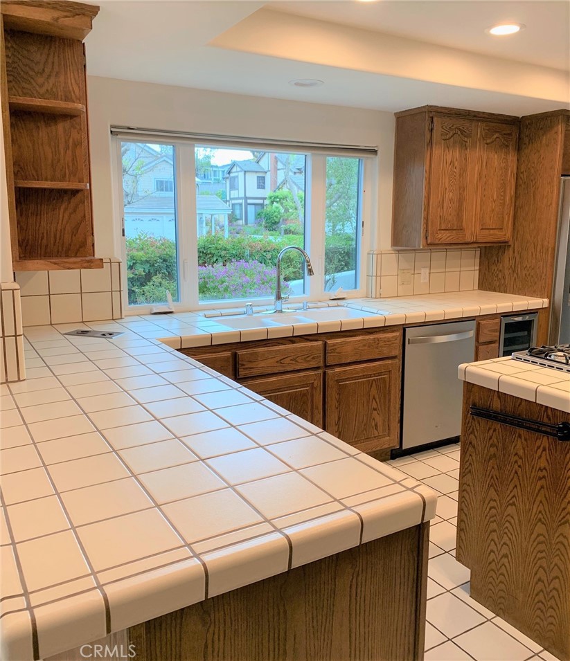 2 Cambridge Manhattan Beach, CA 90266 - Photo 17 of 18 a kitchen with a sink and large window
