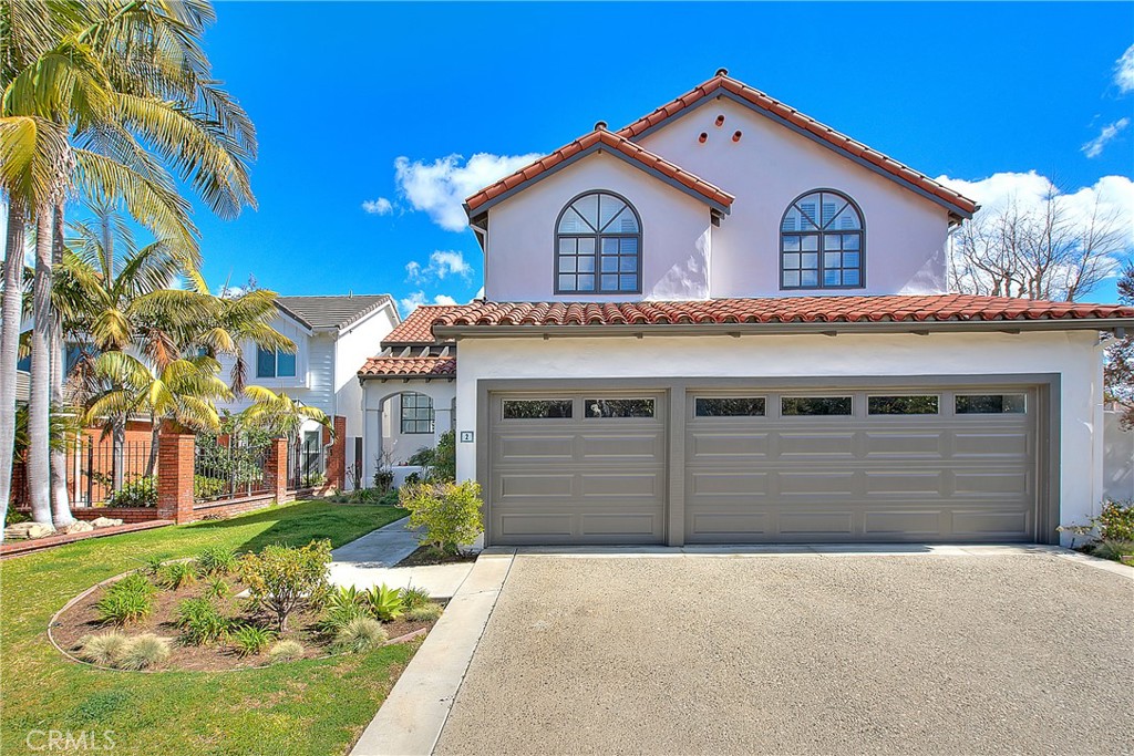 2 Cambridge Manhattan Beach, CA 90266 - Photo 2 of 18 a view of a house with a yard and garage