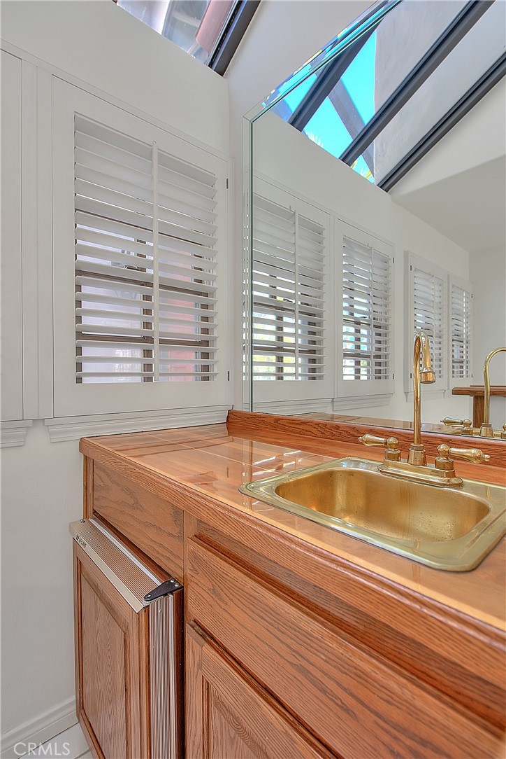 2 Cambridge Manhattan Beach, CA 90266 - Photo 7 of 18 a view of a kitchen with a sink and dishwasher next to a window