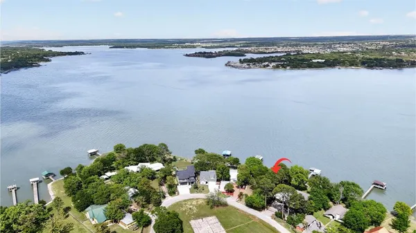 an aerial view of a houses with ocean view