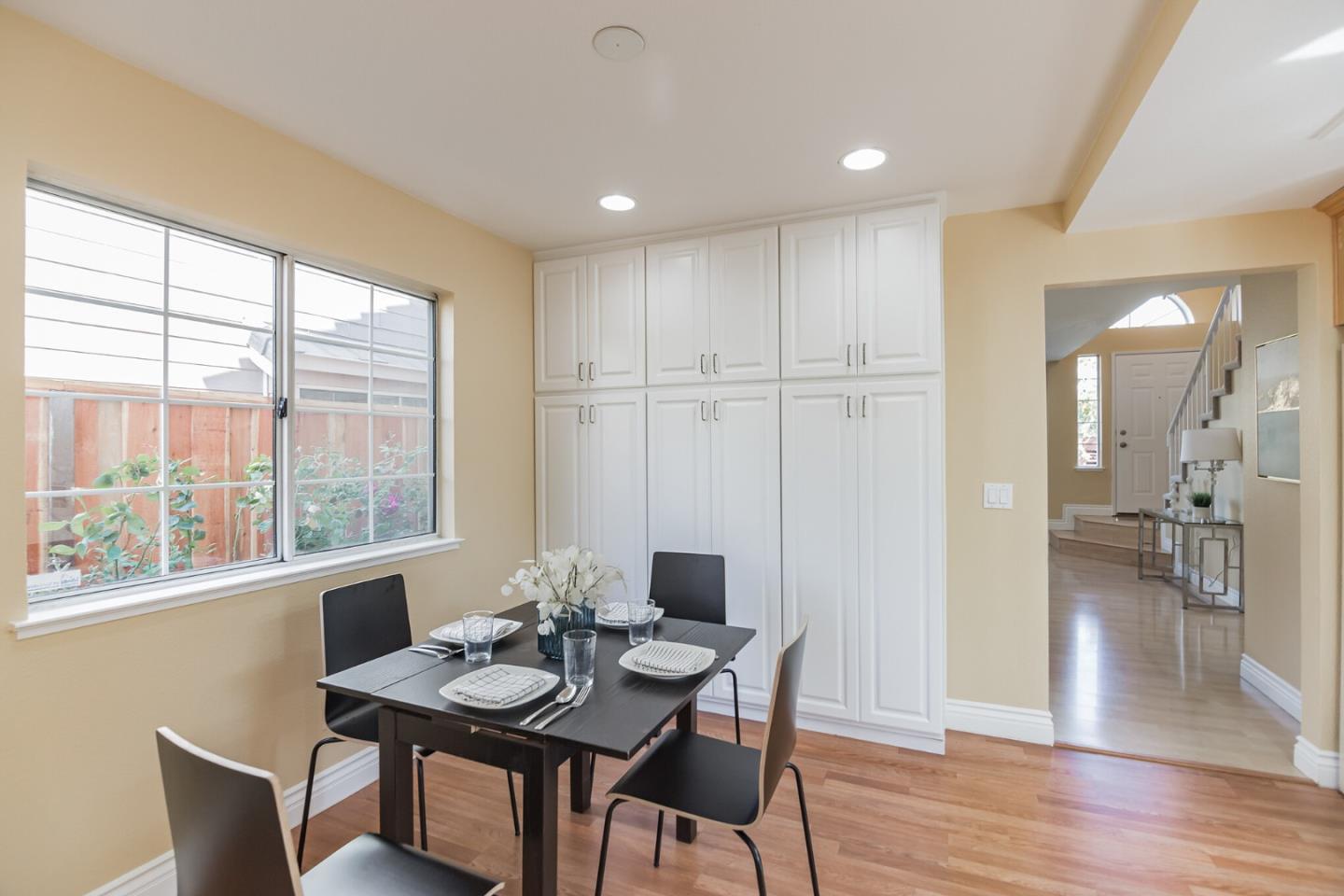 933 Coventry Way Milpitas, CA 95035 - Photo 12 of 30 a view of a dining room with furniture and wooden floor