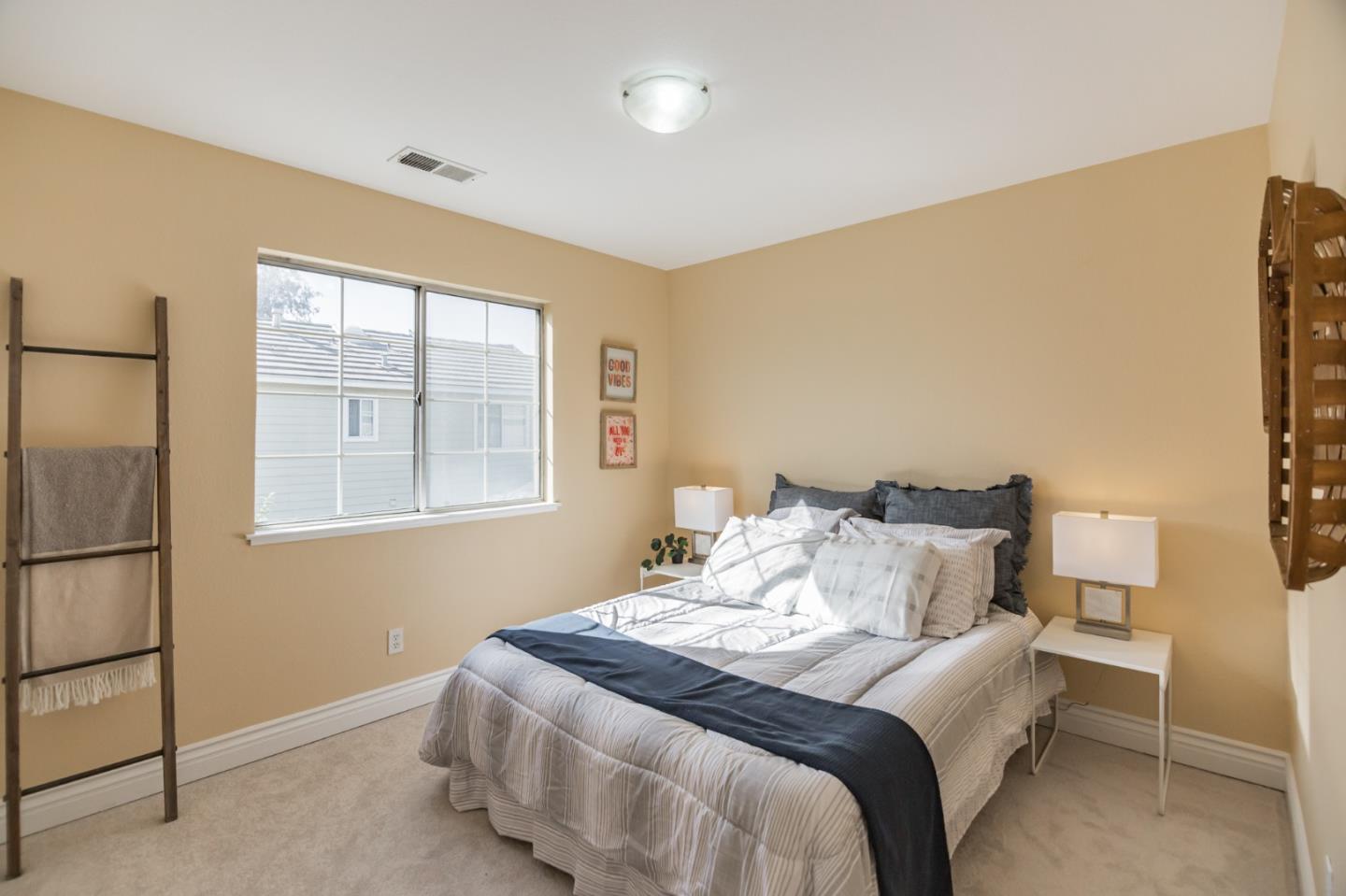 933 Coventry Way Milpitas, CA 95035 - Photo 25 of 30 a bedroom with a bed and a window