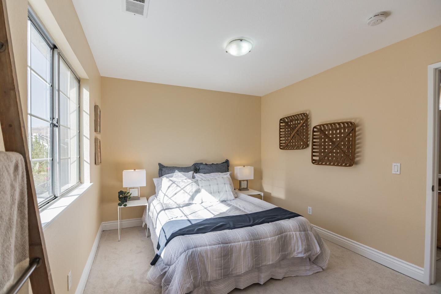 933 Coventry Way Milpitas, CA 95035 - Photo 26 of 30 a bedroom with a bed and a window