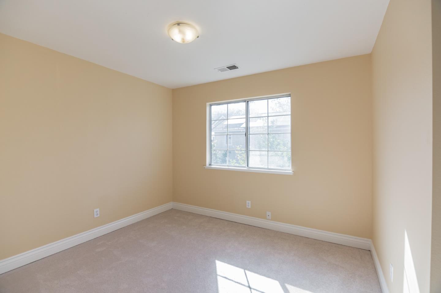 933 Coventry Way Milpitas, CA 95035 - Photo 27 of 30 an empty room with a window