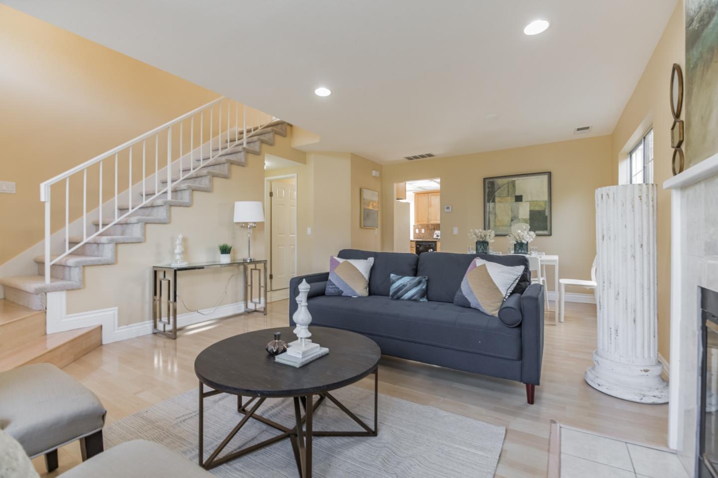 933 Coventry Way Milpitas, CA 95035 - Photo 5 of 30 a living room with furniture a table and a chandelier