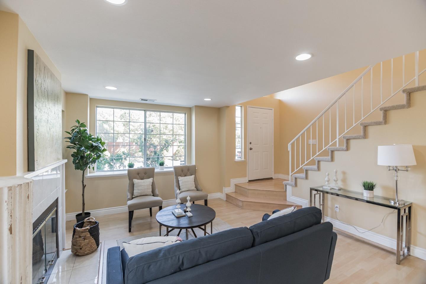 933 Coventry Way Milpitas, CA 95035 - Photo 6 of 30 a living room with furniture and a large window