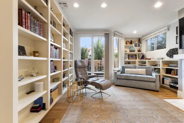 a bedroom with furniture and wooden floor