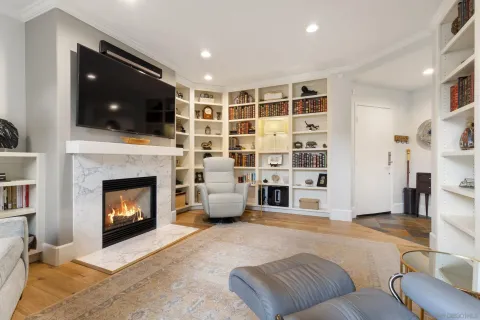 a bathroom with a granite countertop sink tub shower and a mirror