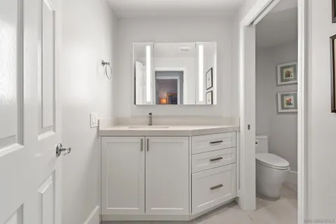 a view of parking garage with cars parked