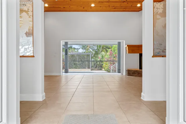 a kitchen with stainless steel appliances granite countertop a refrigerator a sink a stove and white cabinets