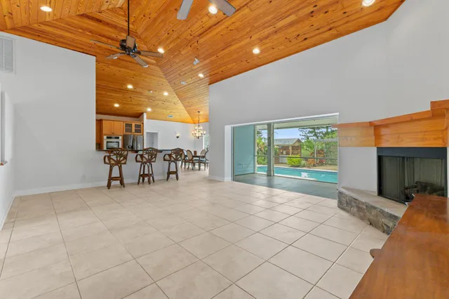 a kitchen with stainless steel appliances granite countertop a stove a sink dishwasher and a refrigerator