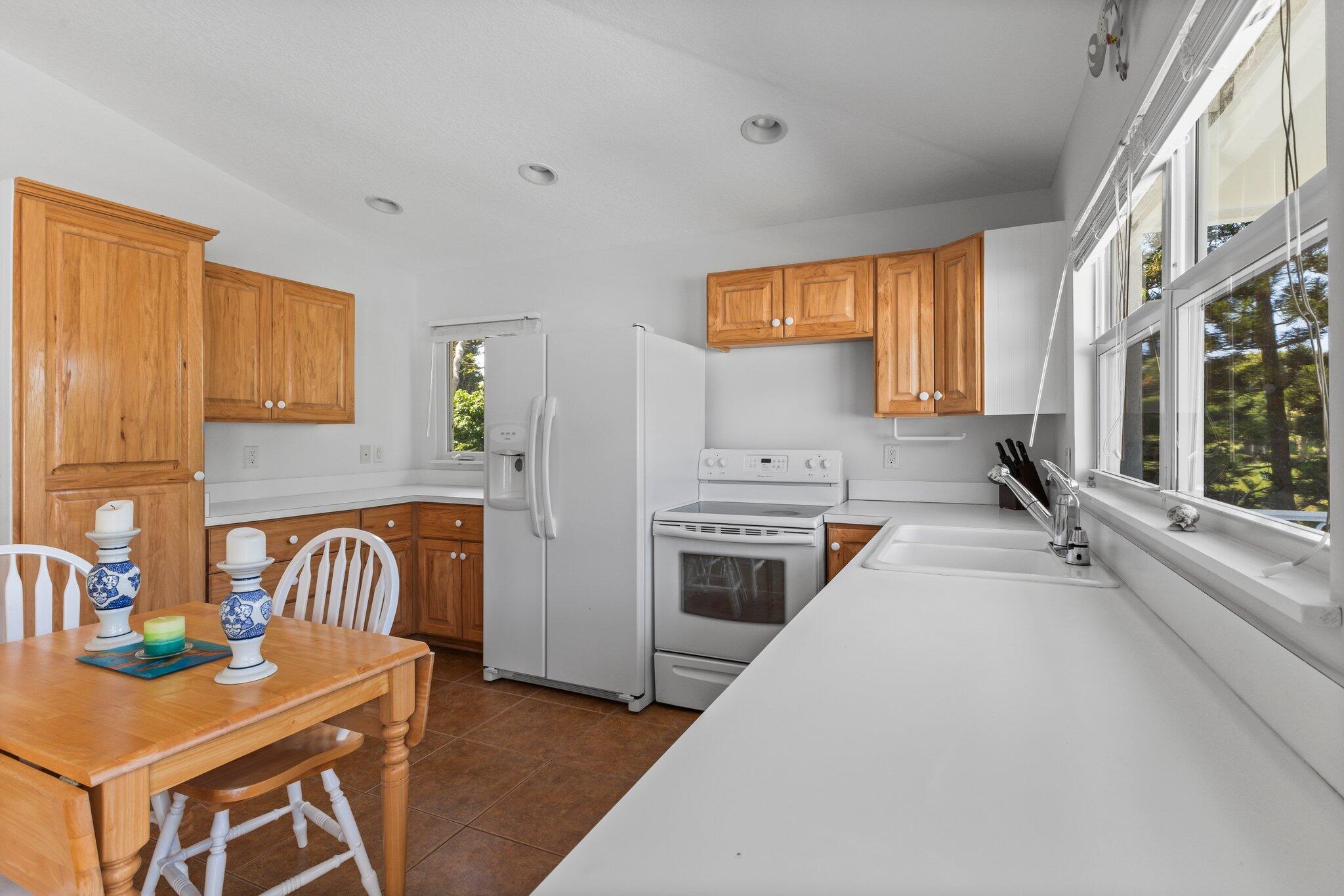 1293 Southwest Heather Terrace Stuart, FL 34997 - Photo 45 of 80 a living room with stainless steel appliances furniture a rug and a window