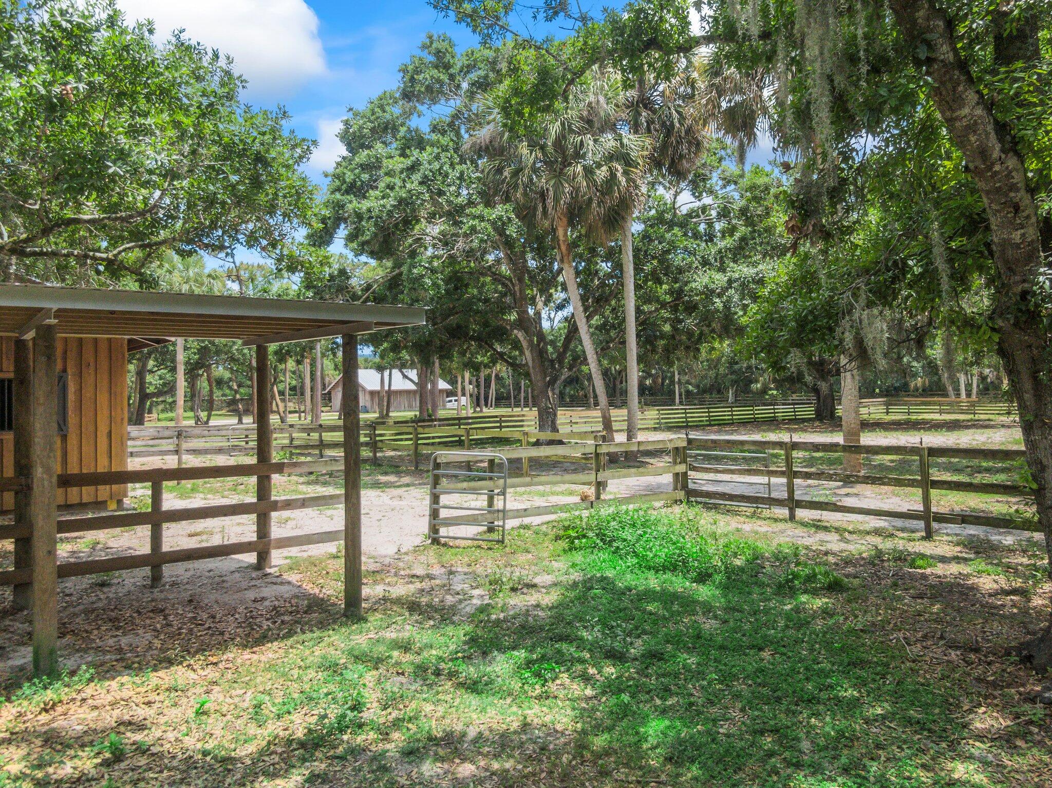 1293 Southwest Heather Terrace Stuart, FL 34997 - Photo 73 of 80 a view of park with a bench