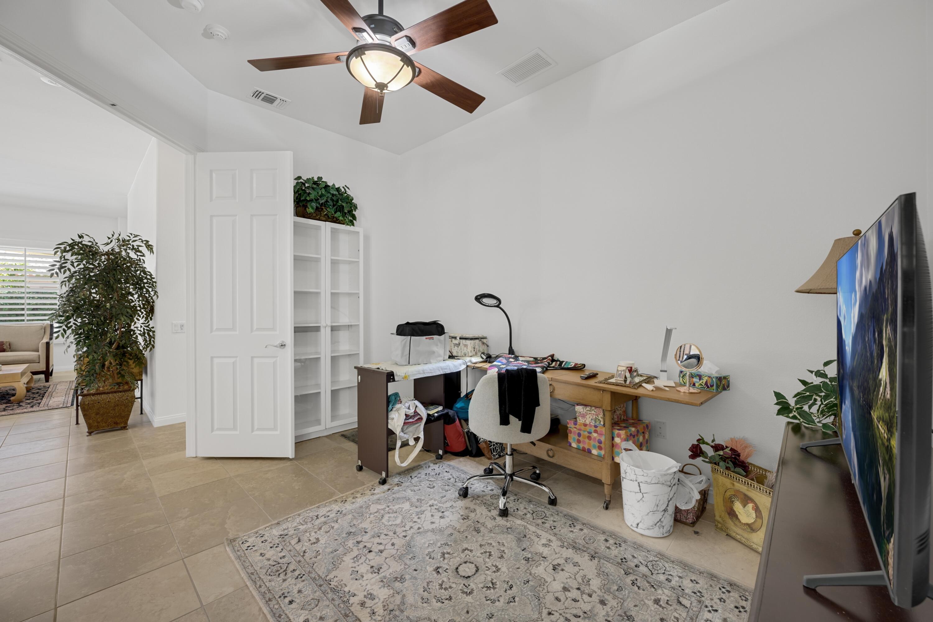 40092 Calle San Geronimo Indio, CA 92203 - Photo 13 of 48 a view of a workspace with furniture and a window