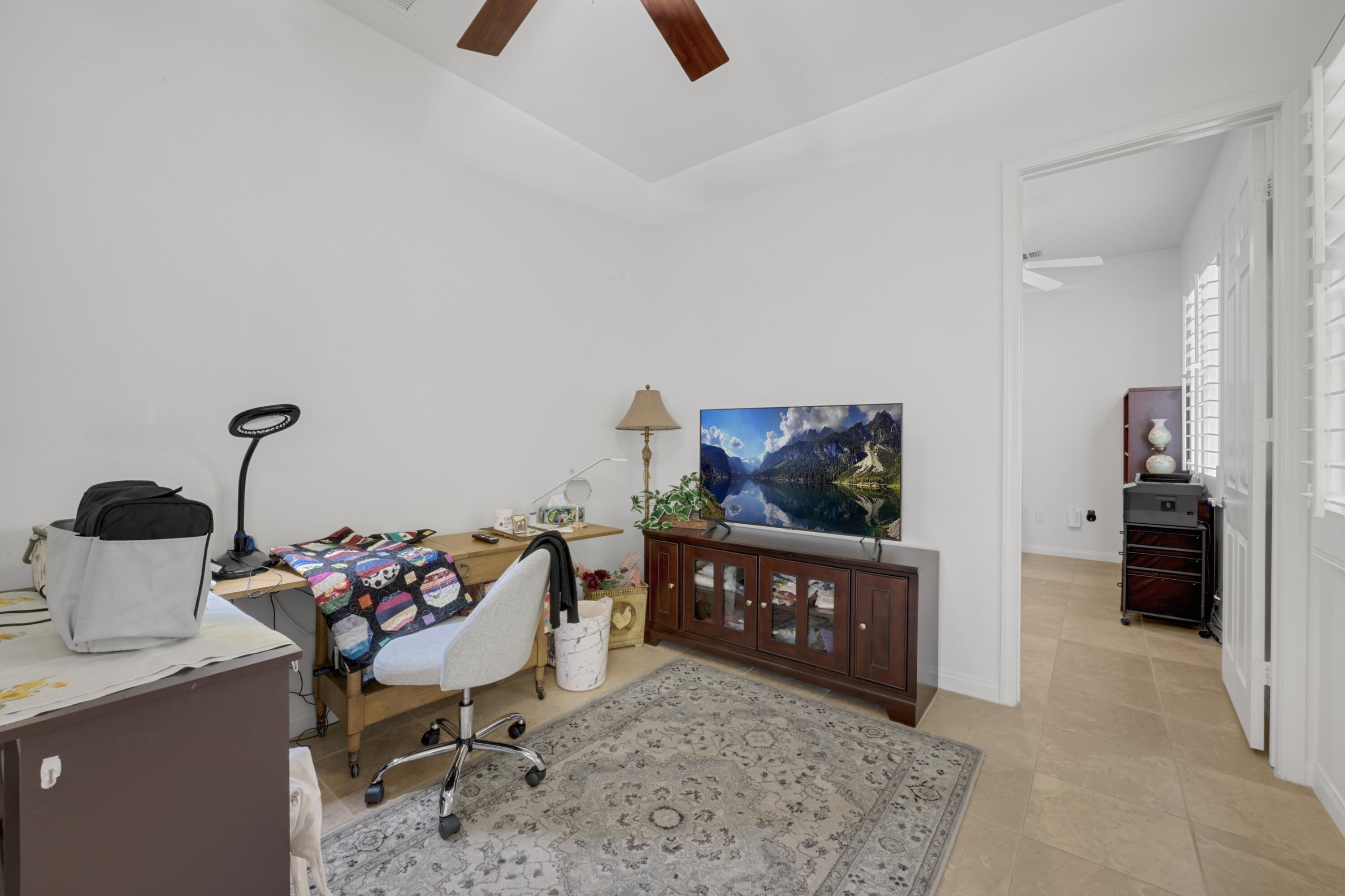 40092 Calle San Geronimo Indio, CA 92203 - Photo 16 of 48 a living room with furniture and a baby crib