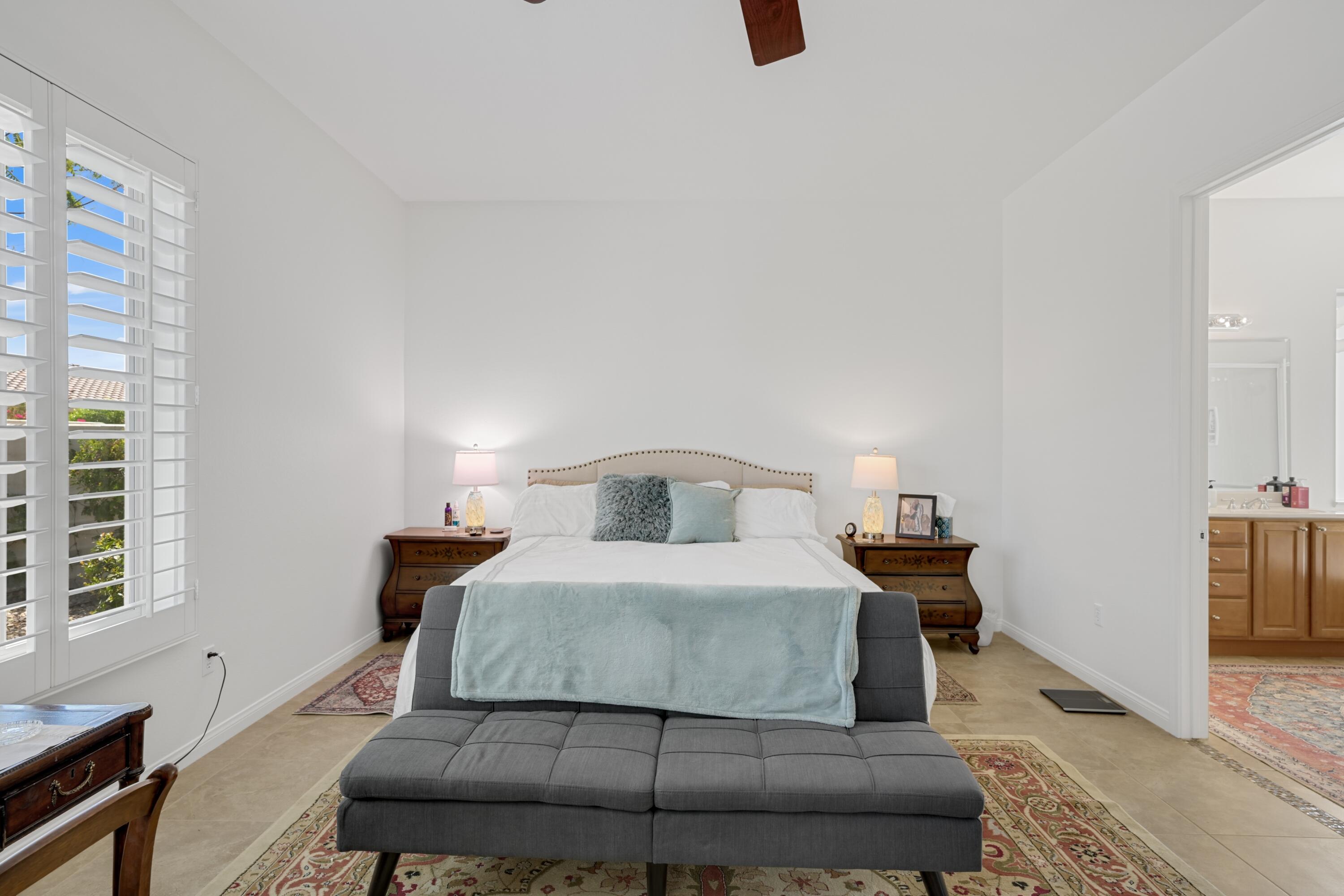 40092 Calle San Geronimo Indio, CA 92203 - Photo 18 of 48 a bedroom with a bed and wooden floor