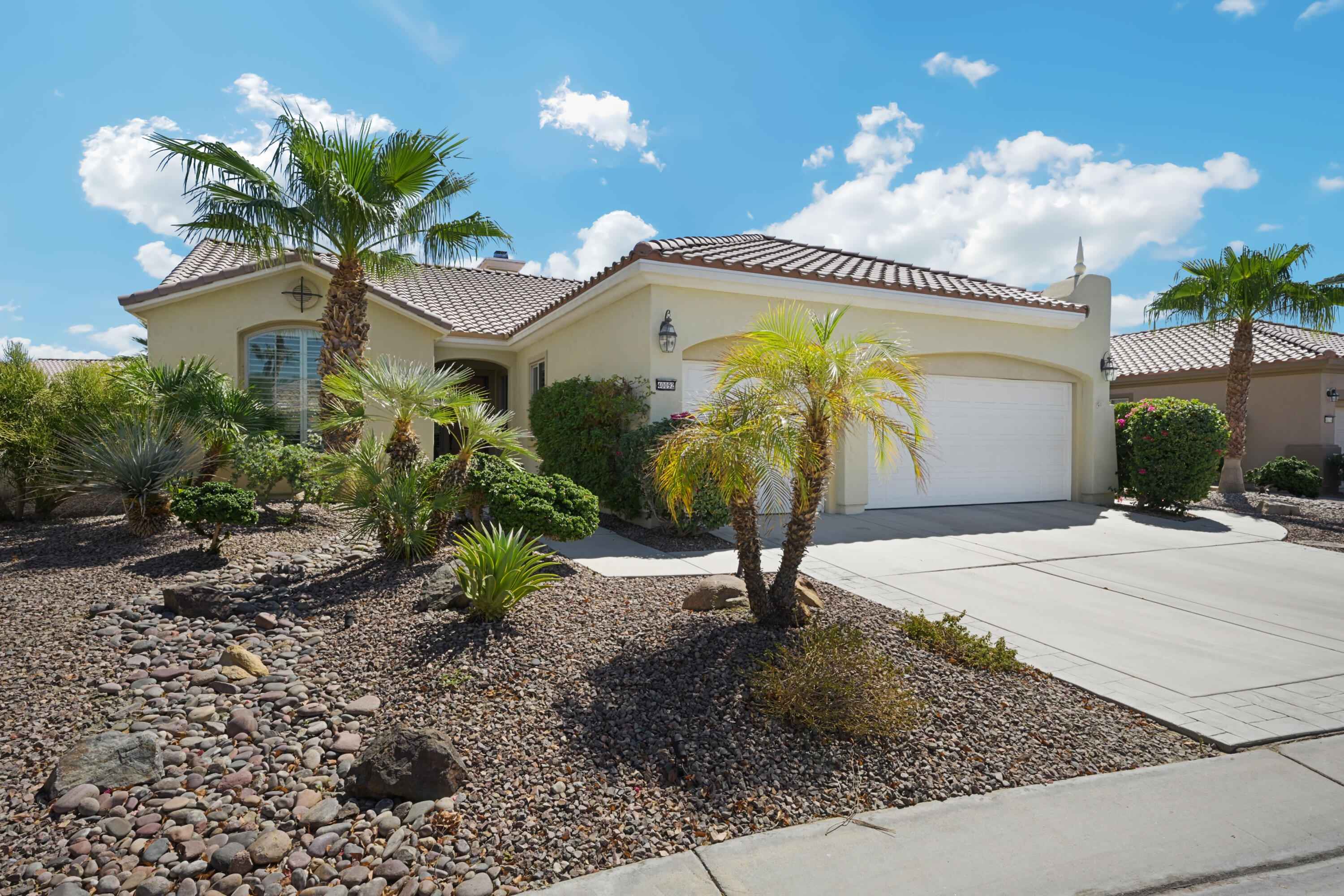 40092 Calle San Geronimo Indio, CA 92203 - Photo 2 of 48 a front view of a house with a garden