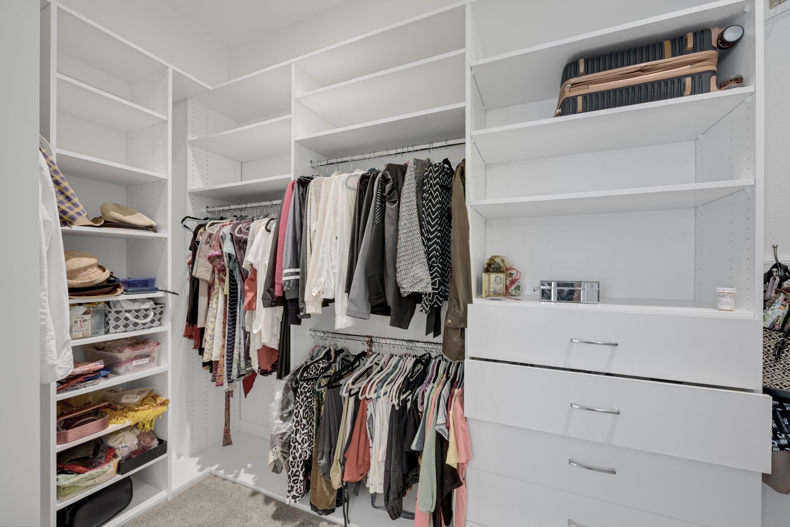 40092 Calle San Geronimo Indio, CA 92203 - Photo 21 of 48 a view of walk in closet with clothes and shoes