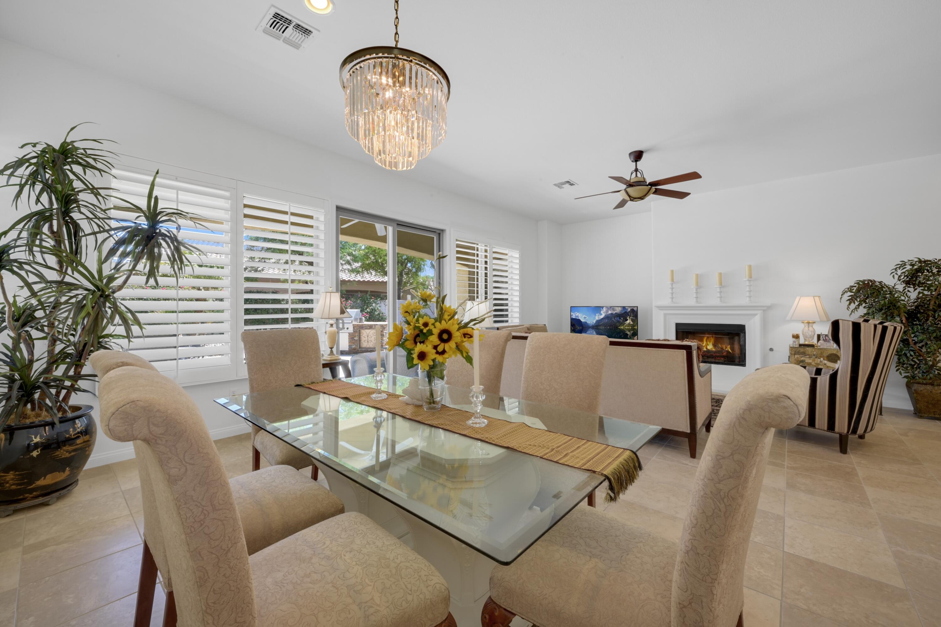 40092 Calle San Geronimo Indio, CA 92203 - Photo 6 of 48 a living room with fireplace furniture and a chandelier