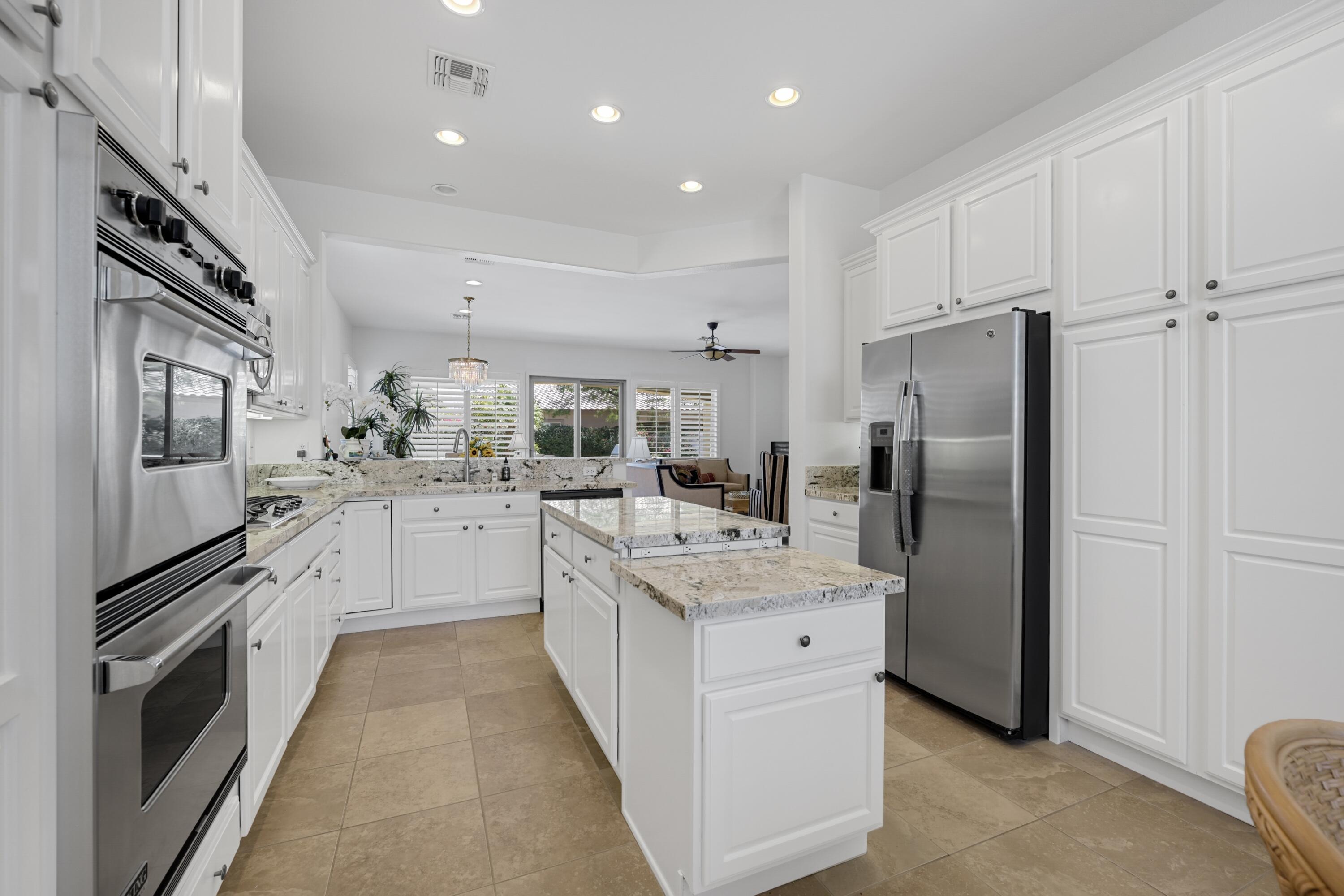 40092 Calle San Geronimo Indio, CA 92203 - Photo 7 of 48 a kitchen with a refrigerator sink and stove