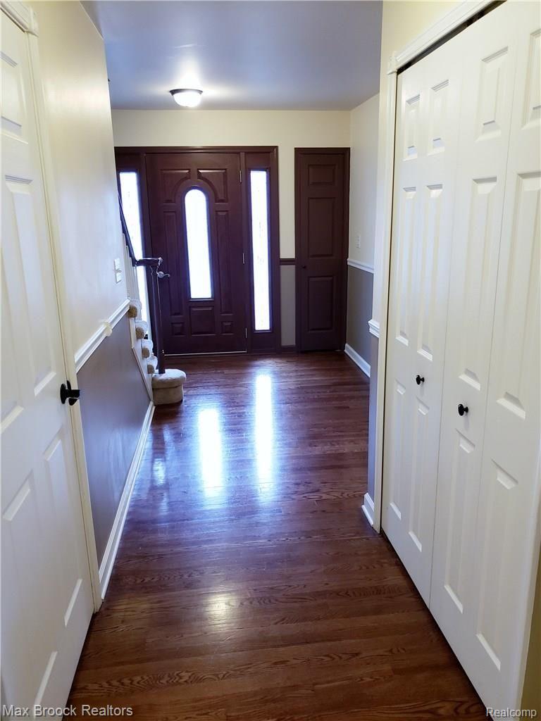 Hall to foyer beautiful Hardwood flooring to single front door with side lites