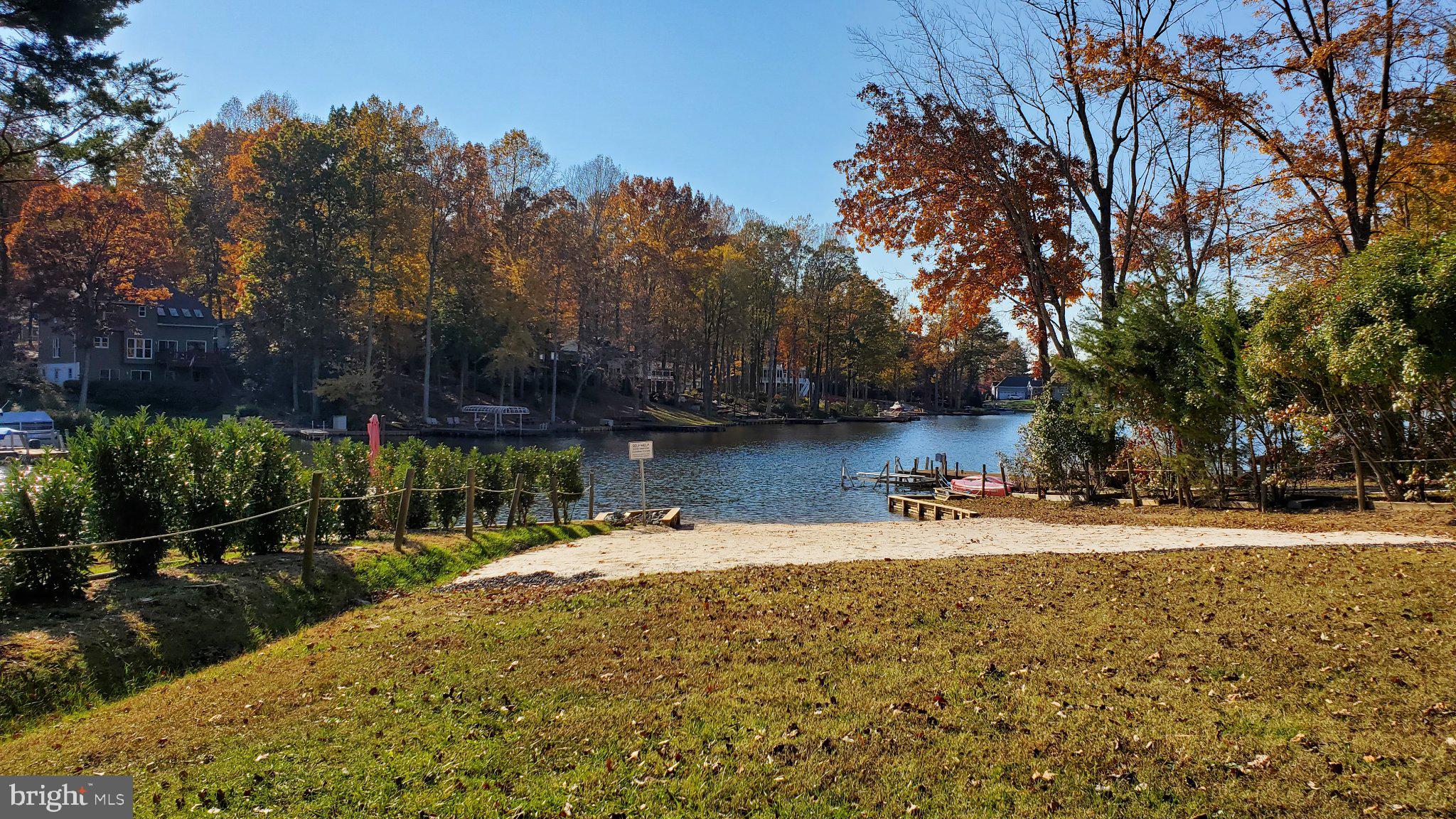 216 Spotswood Road Locust Grove, VA 22508 - Photo 58 of 65 Serene lakeside retreat in autumn hues.