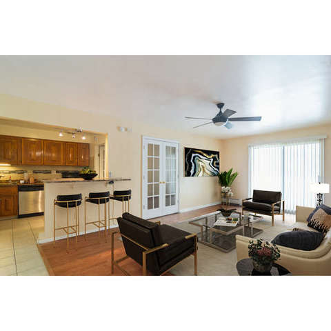 602 East Algonquin Road, Unit 109 Arlington Heights, IL 60005 - Photo 3 of 15 a living room with furniture and a kitchen