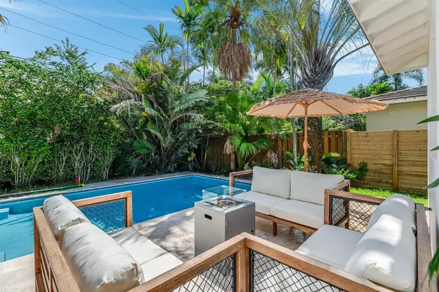 a spacious bedroom with two beds and a large window