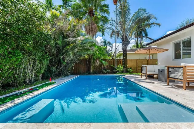a bathroom with a sink a mirror and shower