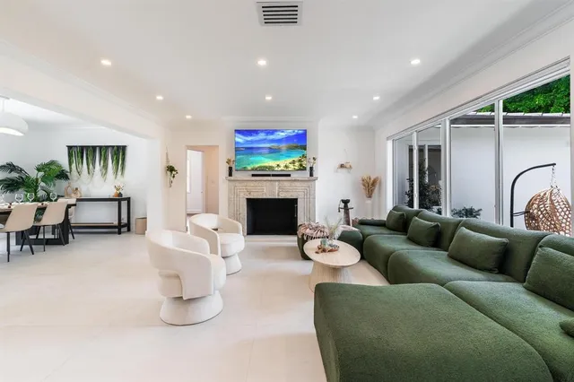 a kitchen with stainless steel appliances granite countertop a sink and a refrigerator