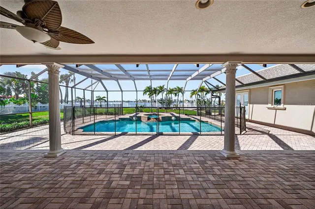 a view of a swimming pool with a patio
