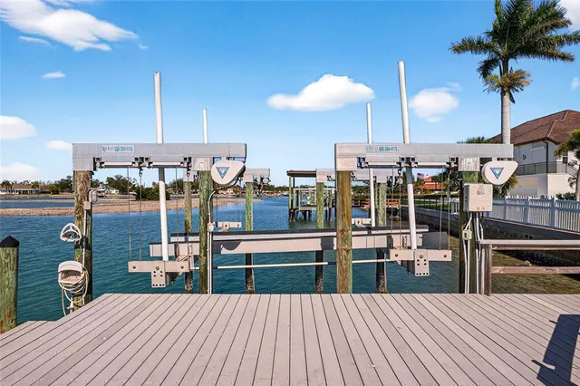 a room with lots of wooden furniture and a chandelier