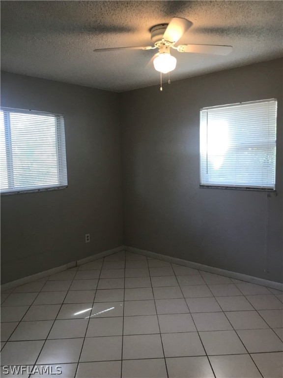 2316 Caladium Road Fort Myers, FL 33905 - Photo 15 of 18 en empty room with windows and fan