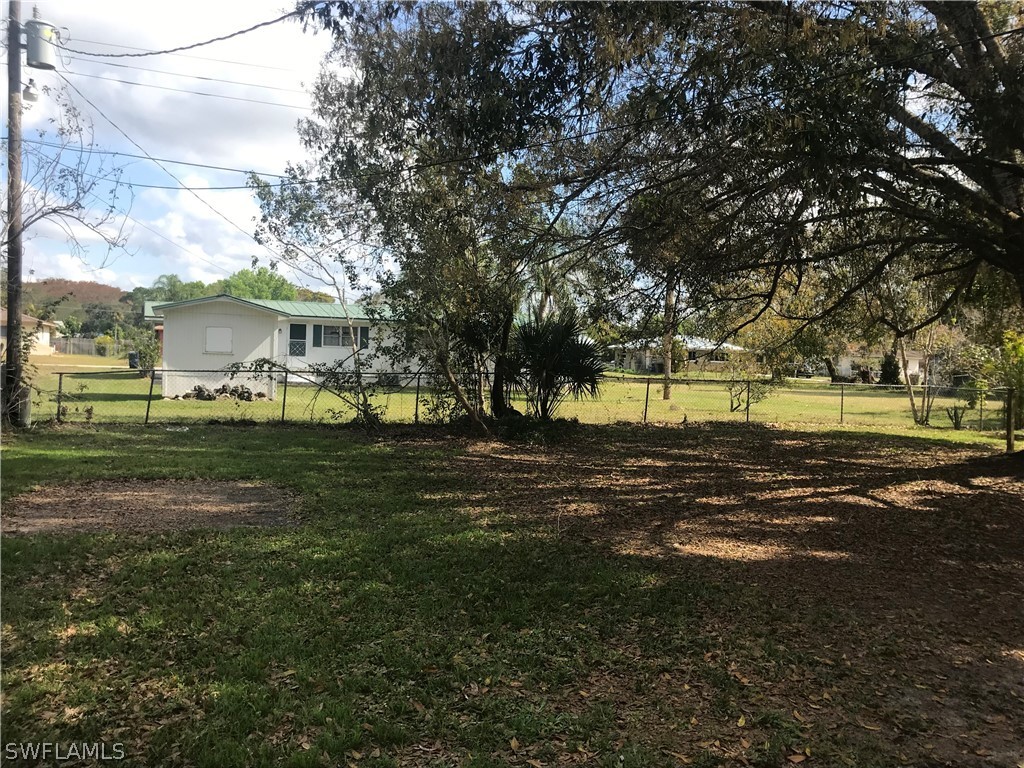 2316 Caladium Road Fort Myers, FL 33905 - Photo 17 of 18 a view of a park with large trees