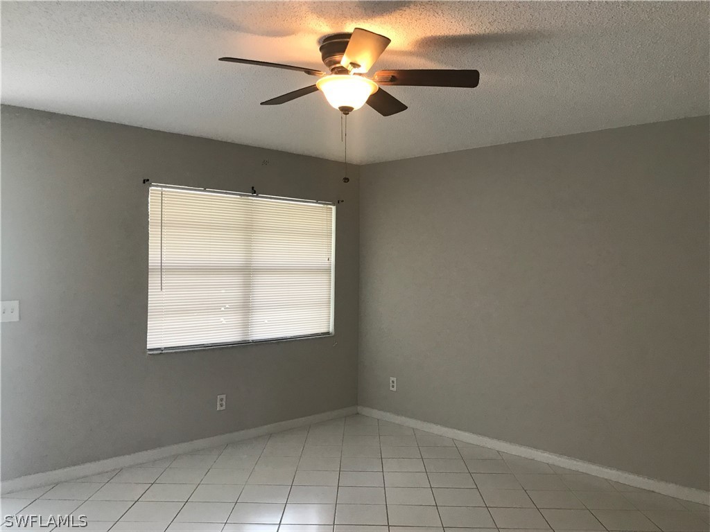2316 Caladium Road Fort Myers, FL 33905 - Photo 4 of 18 a view of an empty room with a window