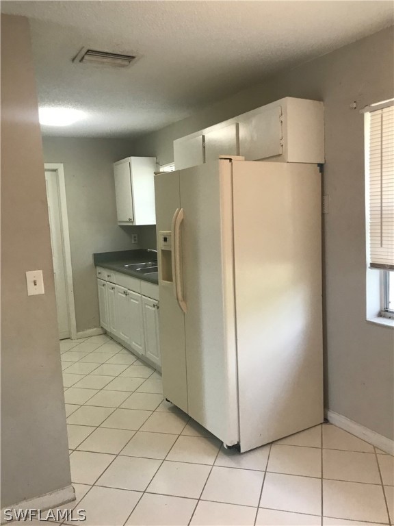 2316 Caladium Road Fort Myers, FL 33905 - Photo 5 of 18 a kitchen with stainless steel appliances a refrigerator and a sink