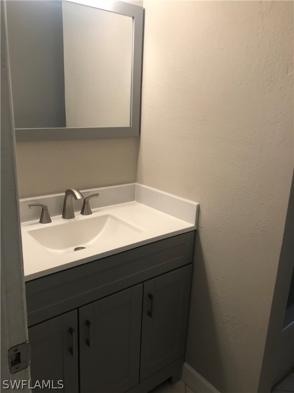 2316 Caladium Road Fort Myers, FL 33905 - Photo 7 of 18 a sink with a vanity
